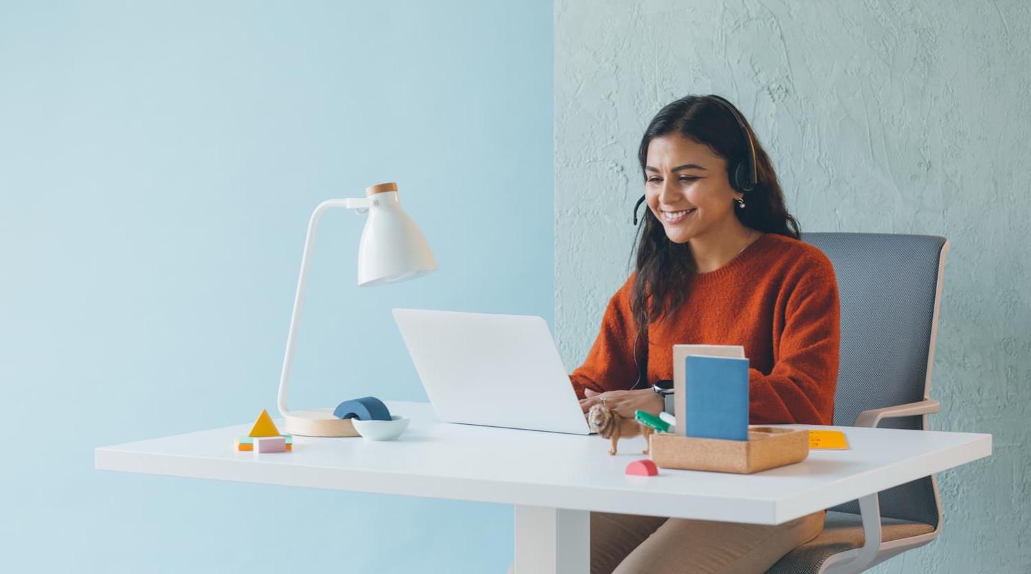 Engineer at Zendesk sits at her desk